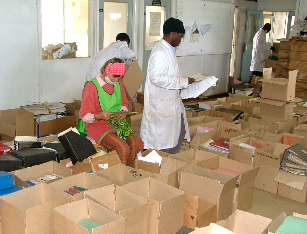 Web - Nicky B and Bethuel M sorting documents at 'Ground Zero' - KCO 2004